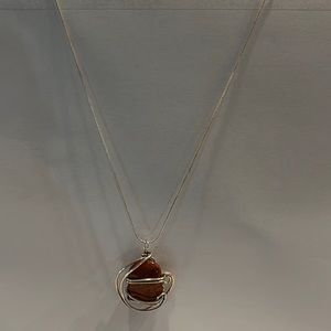 Handmade sterling silver necklace with rust colored stone